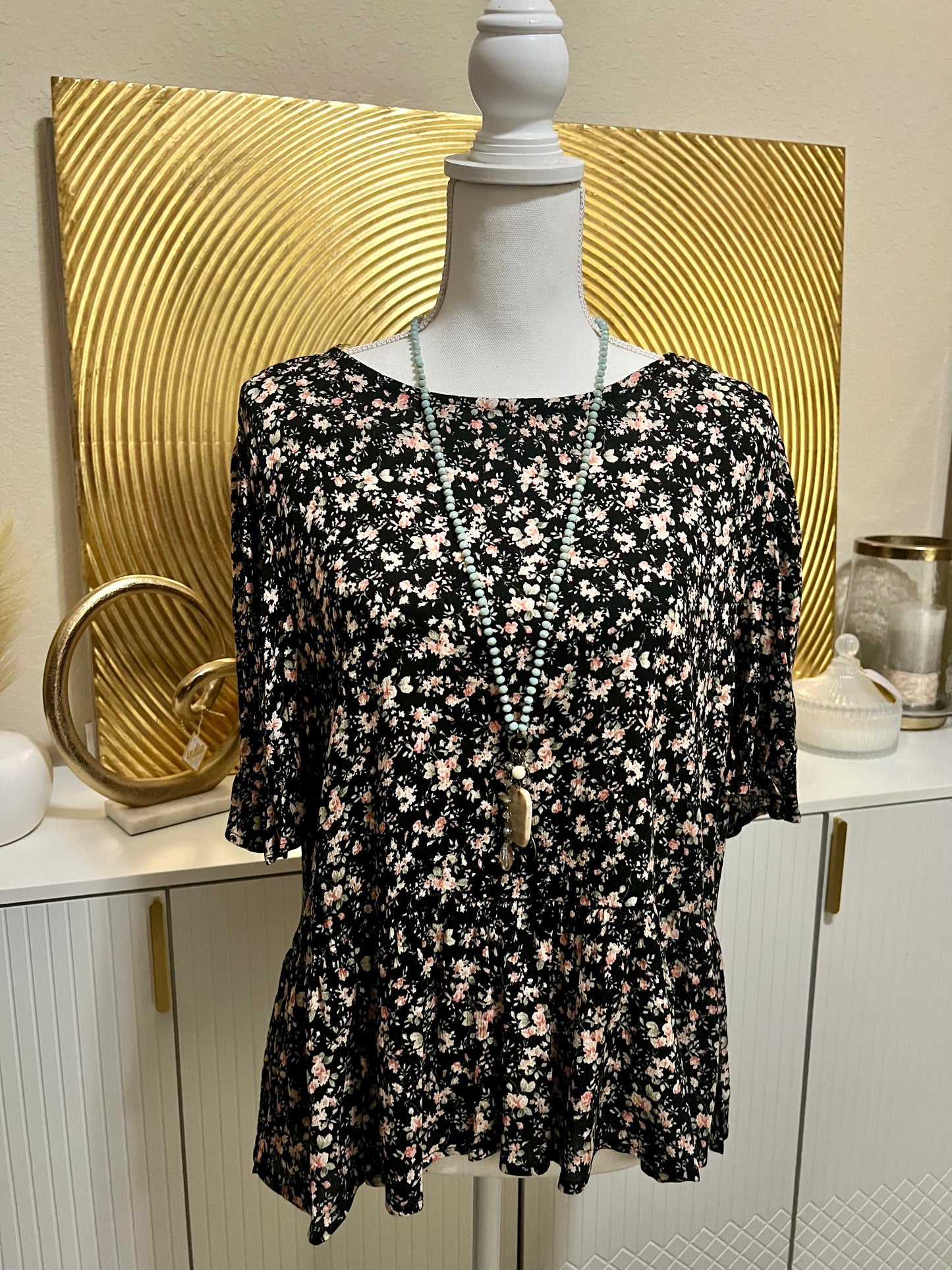 Black floral blouse with cutout and bows in back