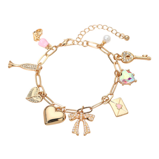 Gold charm bracelet heart, bow, key