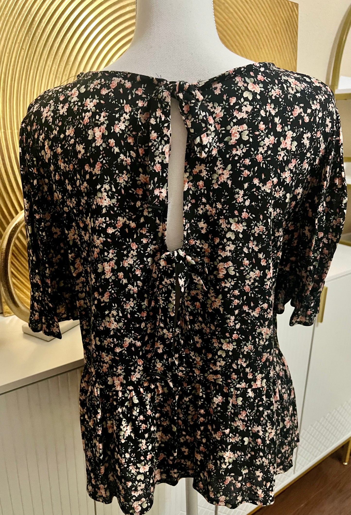 Black floral blouse with cutout and bows in back