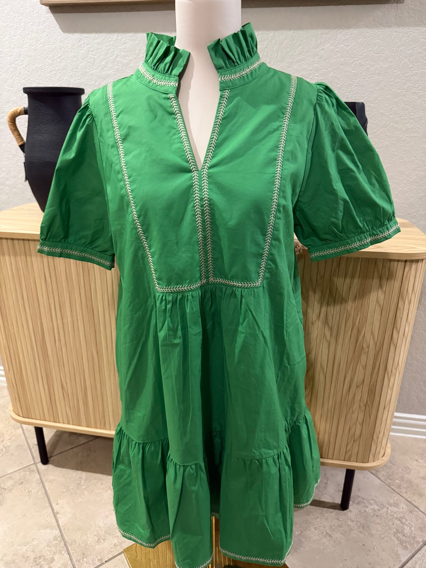 Green lined dress with embroidery detail