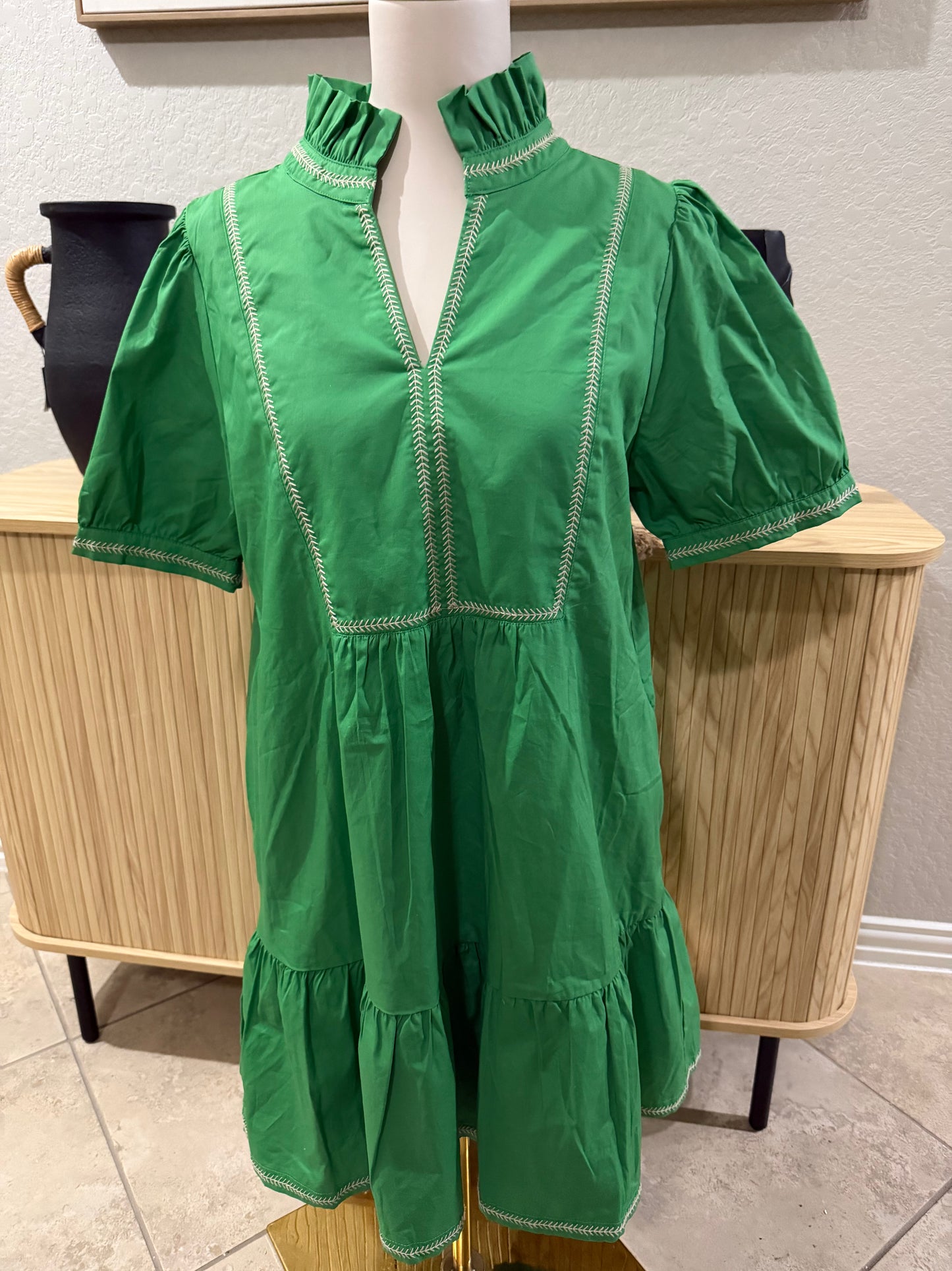Green lined dress with embroidery detail